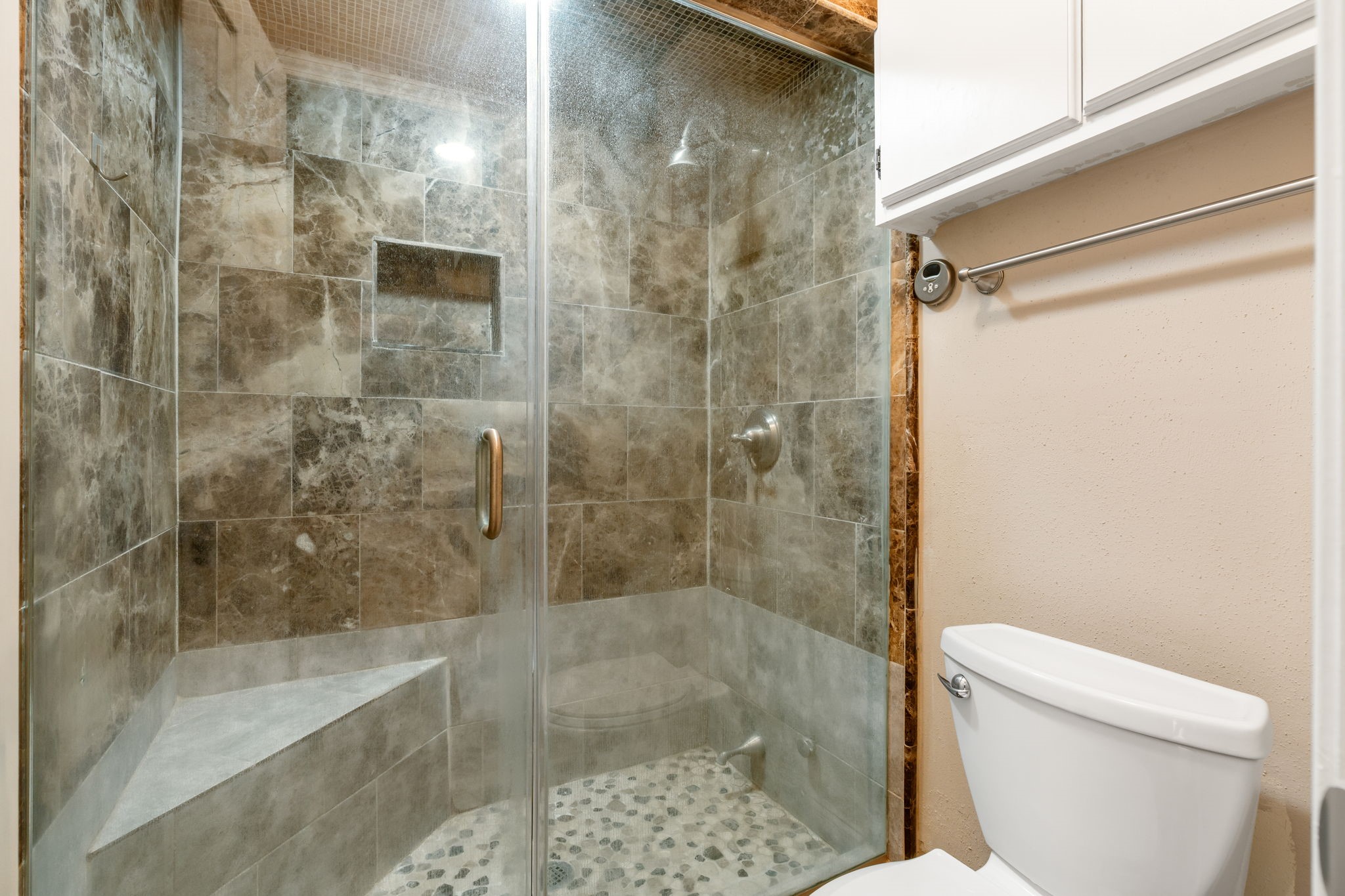 204 Lakeview Terrace, Unit G Conroe, TX 77356 - Photo 21 of 26 a bathroom with a shower and a toilet