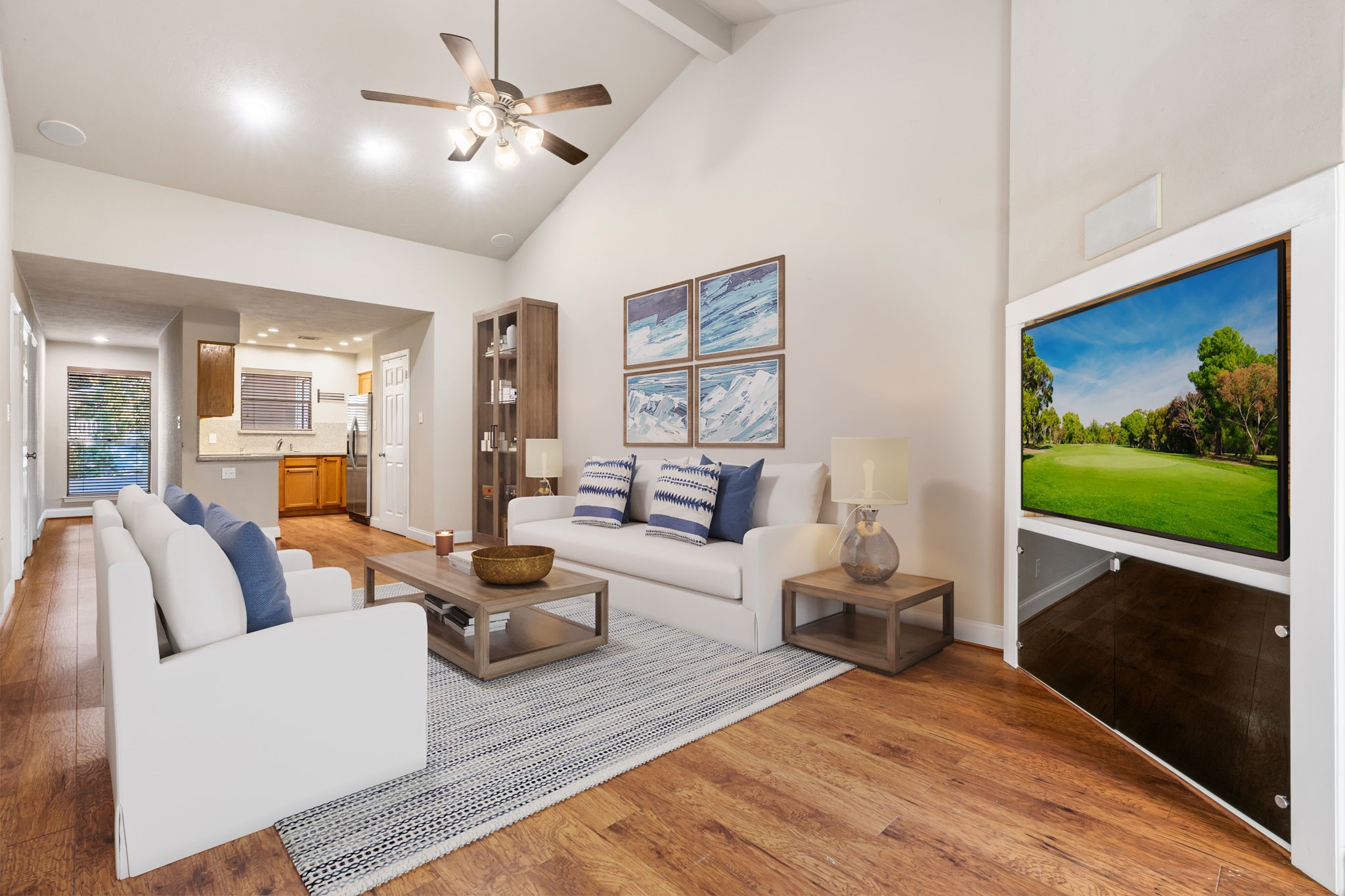 204 Lakeview Terrace, Unit G Conroe, TX 77356 - Photo 3 of 26 a living room with furniture and a flat screen tv