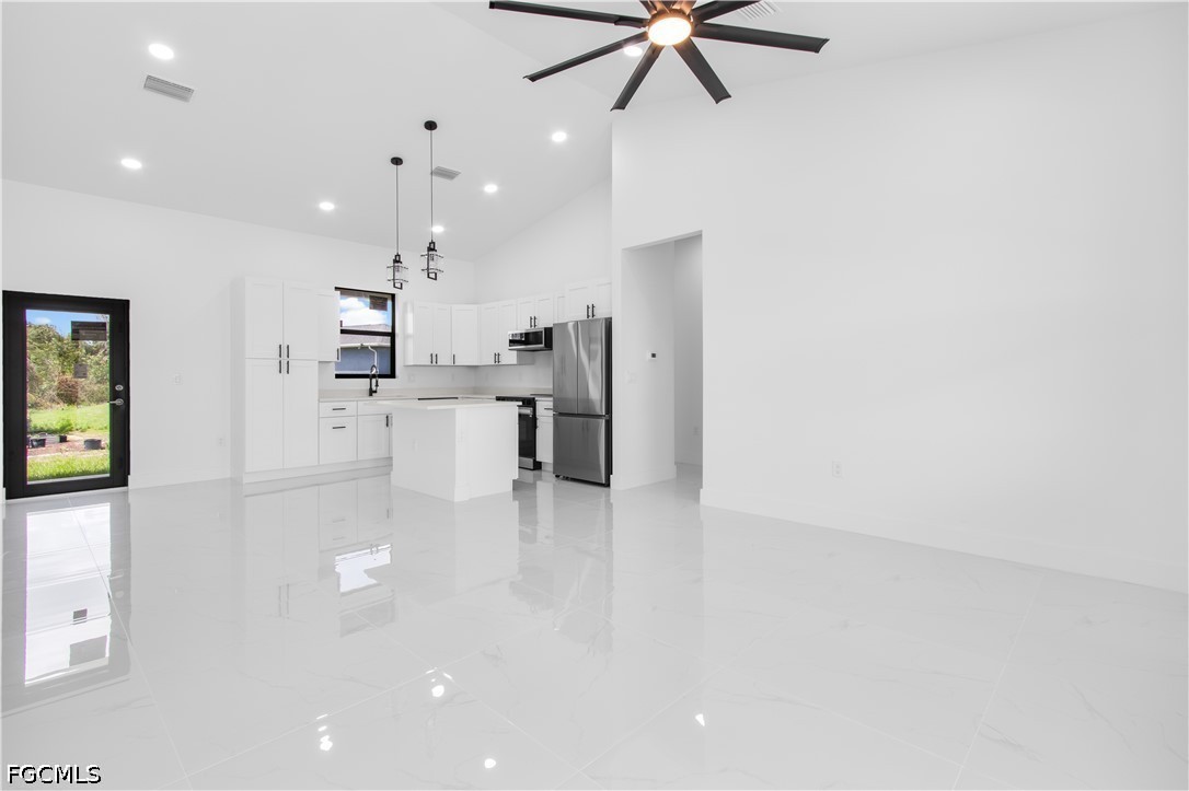 3004 South Tulip Road LaBelle, FL 33935 - Photo 9 of 24 a view of a kitchen with a sink stainless steel appliances and cabinets
