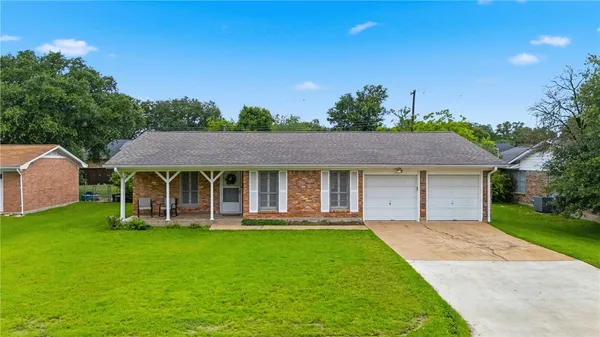 a view of a house with a yard porch and sitting area