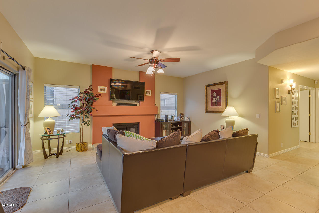 11255 West Piccadilly Road Avondale, AZ 85392 - Photo 14 of 29 a living room with furniture and a chandelier