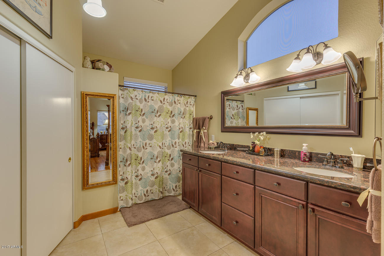 11255 West Piccadilly Road Avondale, AZ 85392 - Photo 20 of 29 a spacious bathroom with a double vanity sink and a mirror