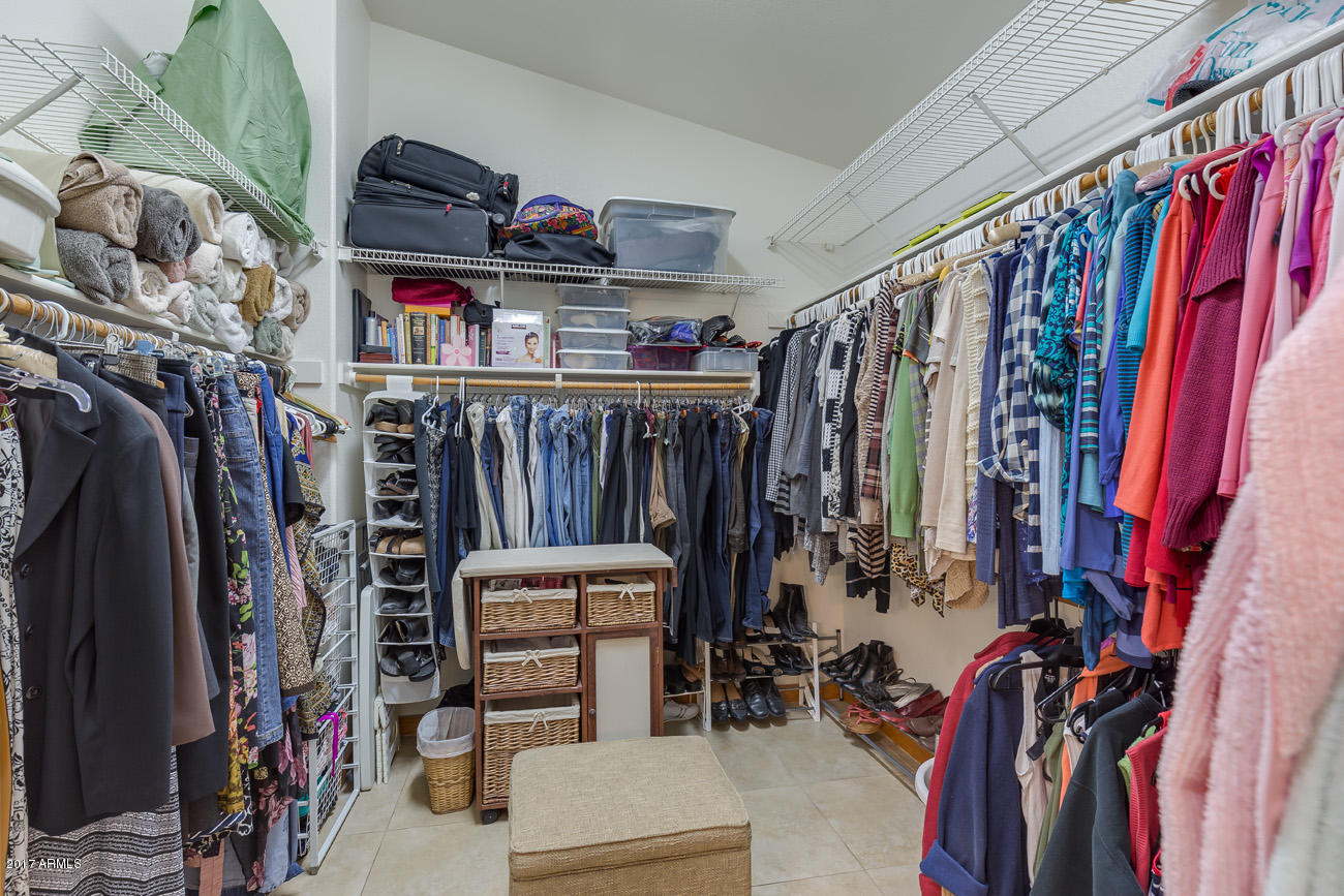11255 West Piccadilly Road Avondale, AZ 85392 - Photo 24 of 29 a view of walk in closet with clothes and shoes