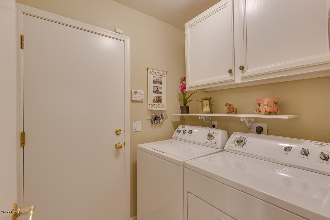 11255 West Piccadilly Road Avondale, AZ 85392 - Photo 26 of 29 a utility room with dryer and washer