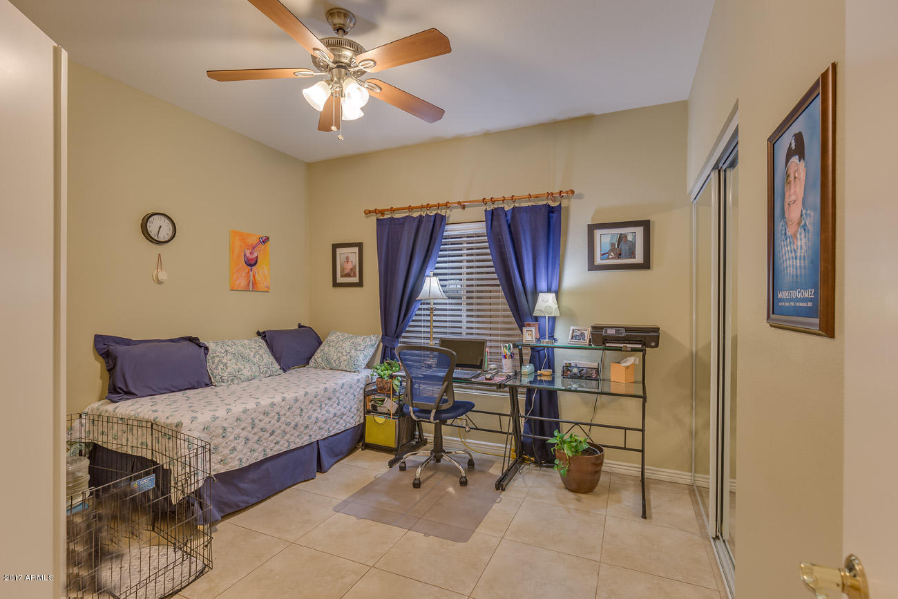 11255 West Piccadilly Road Avondale, AZ 85392 - Photo 28 of 29 a living room with furniture and wooden floor
