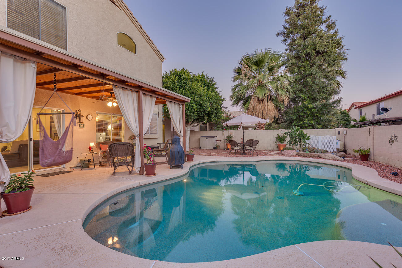 11255 West Piccadilly Road Avondale, AZ 85392 - Photo 5 of 29 a view of a swimming pool with a patio