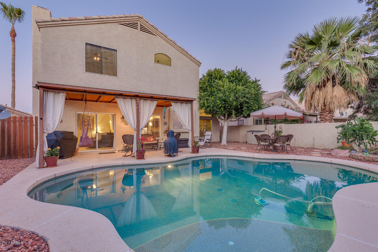 11255 West Piccadilly Road Avondale, AZ 85392 - Photo 6 of 29 a swimming pool with outdoor seating and yard