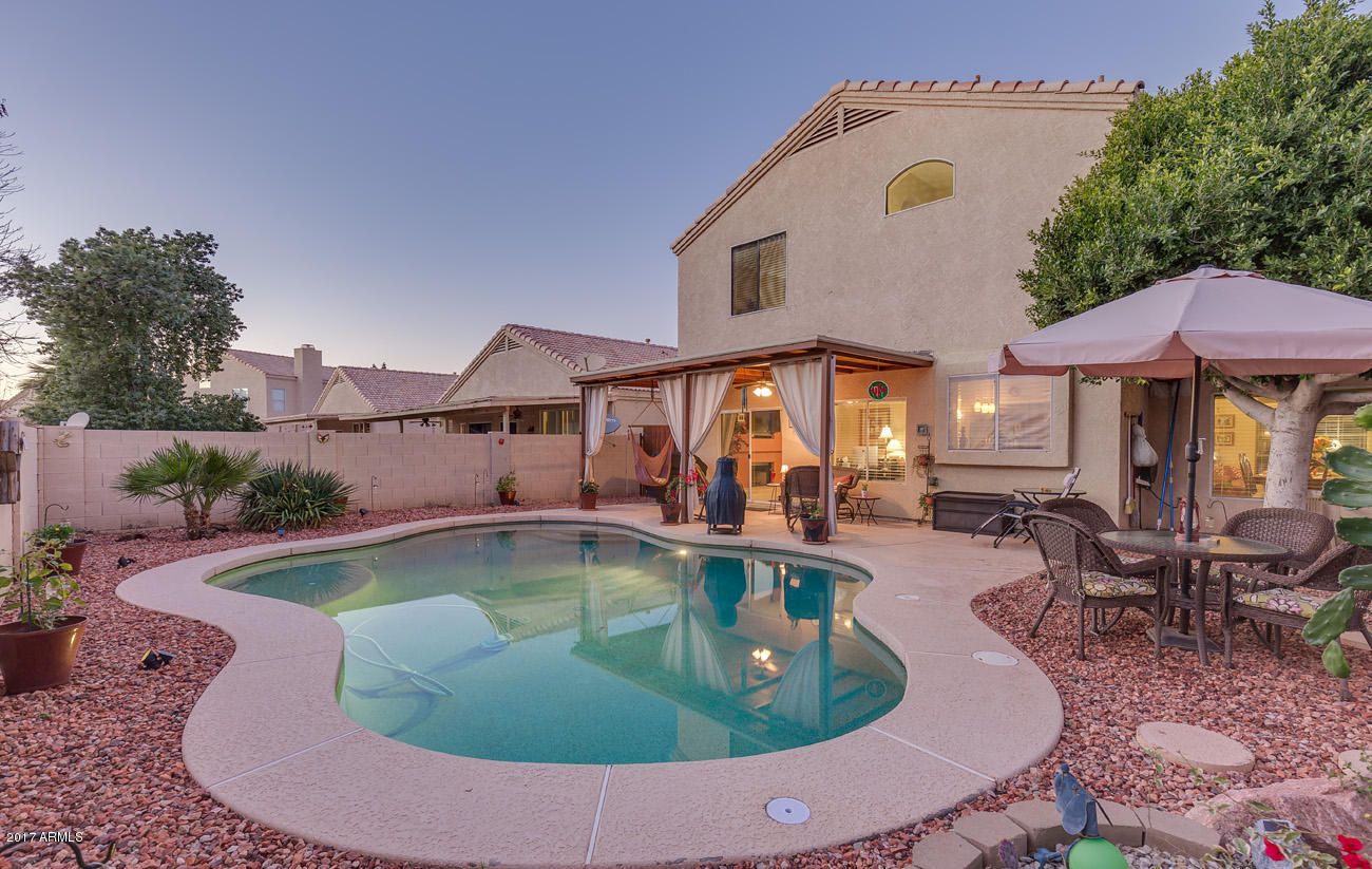 11255 West Piccadilly Road Avondale, AZ 85392 - Photo 8 of 29 a view of a house with swimming pool and sitting area