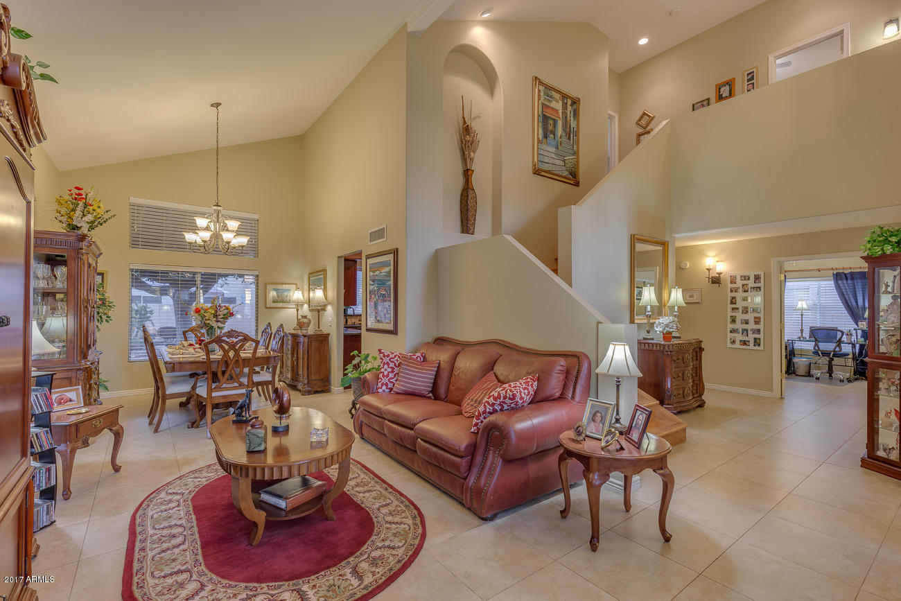 11255 West Piccadilly Road Avondale, AZ 85392 - Photo 10 of 29 a living room with furniture kitchen and a chandelier