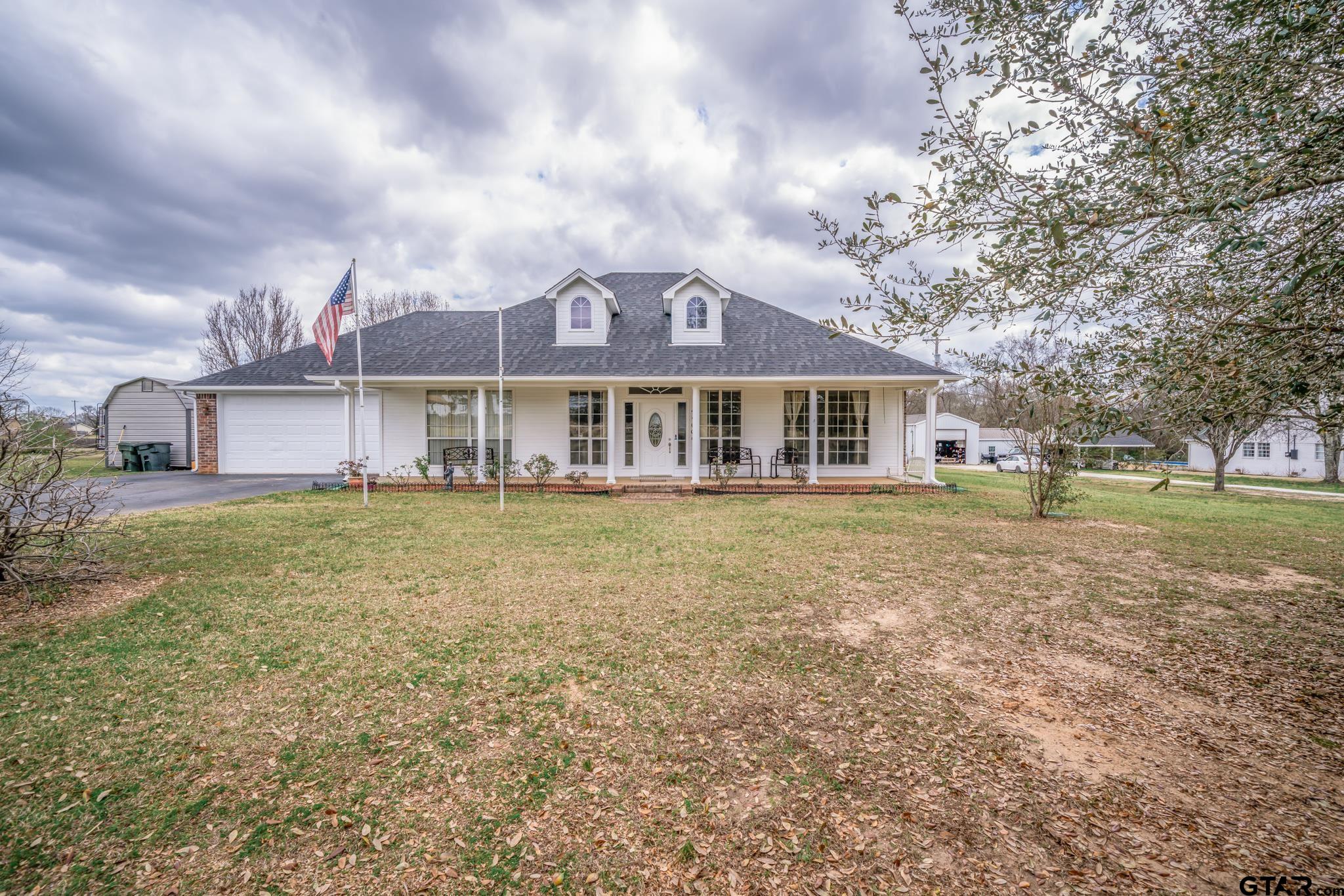 2266 Big Woods Road Longview, TX 75605 - Photo 1 of 48 front view of a house with a yard