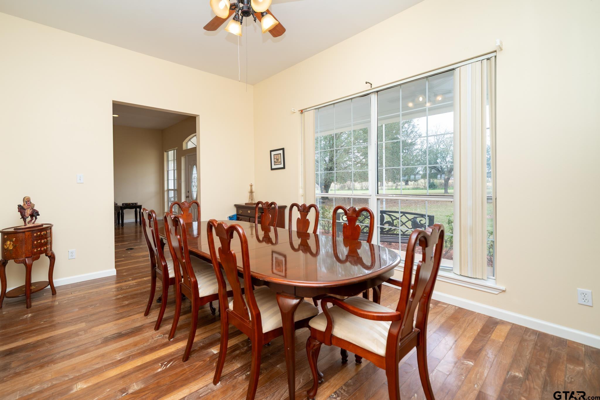 2266 Big Woods Road Longview, TX 75605 - Photo 20 of 48 a dining room with furniture and wooden floor