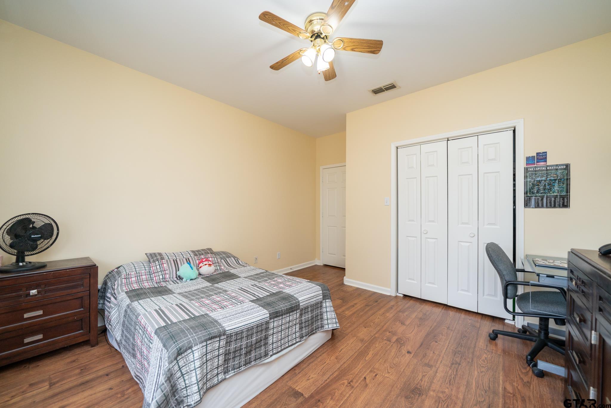 2266 Big Woods Road Longview, TX 75605 - Photo 28 of 48 a bedroom with a bed and a table