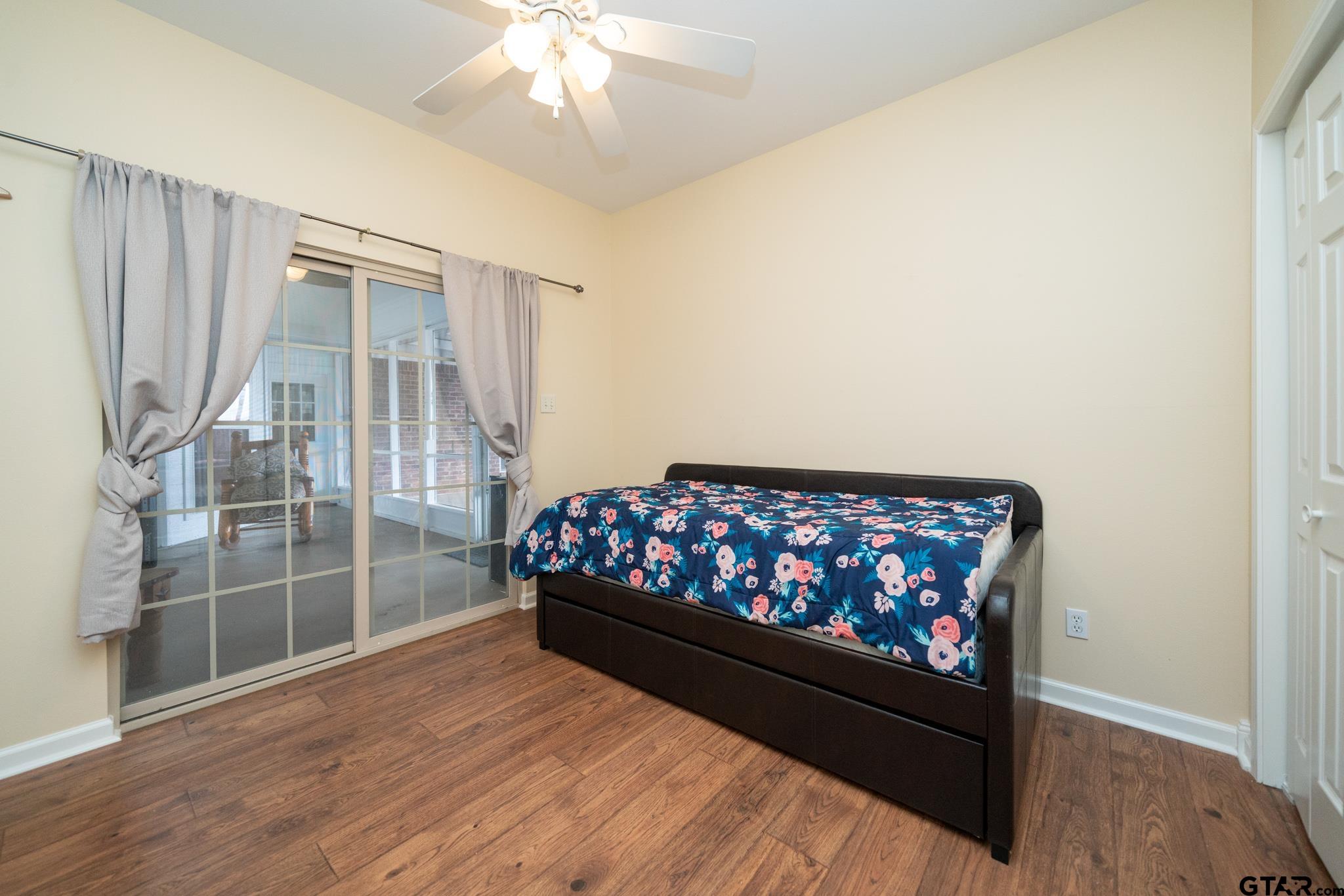 2266 Big Woods Road Longview, TX 75605 - Photo 32 of 48 a bedroom with wooden floor