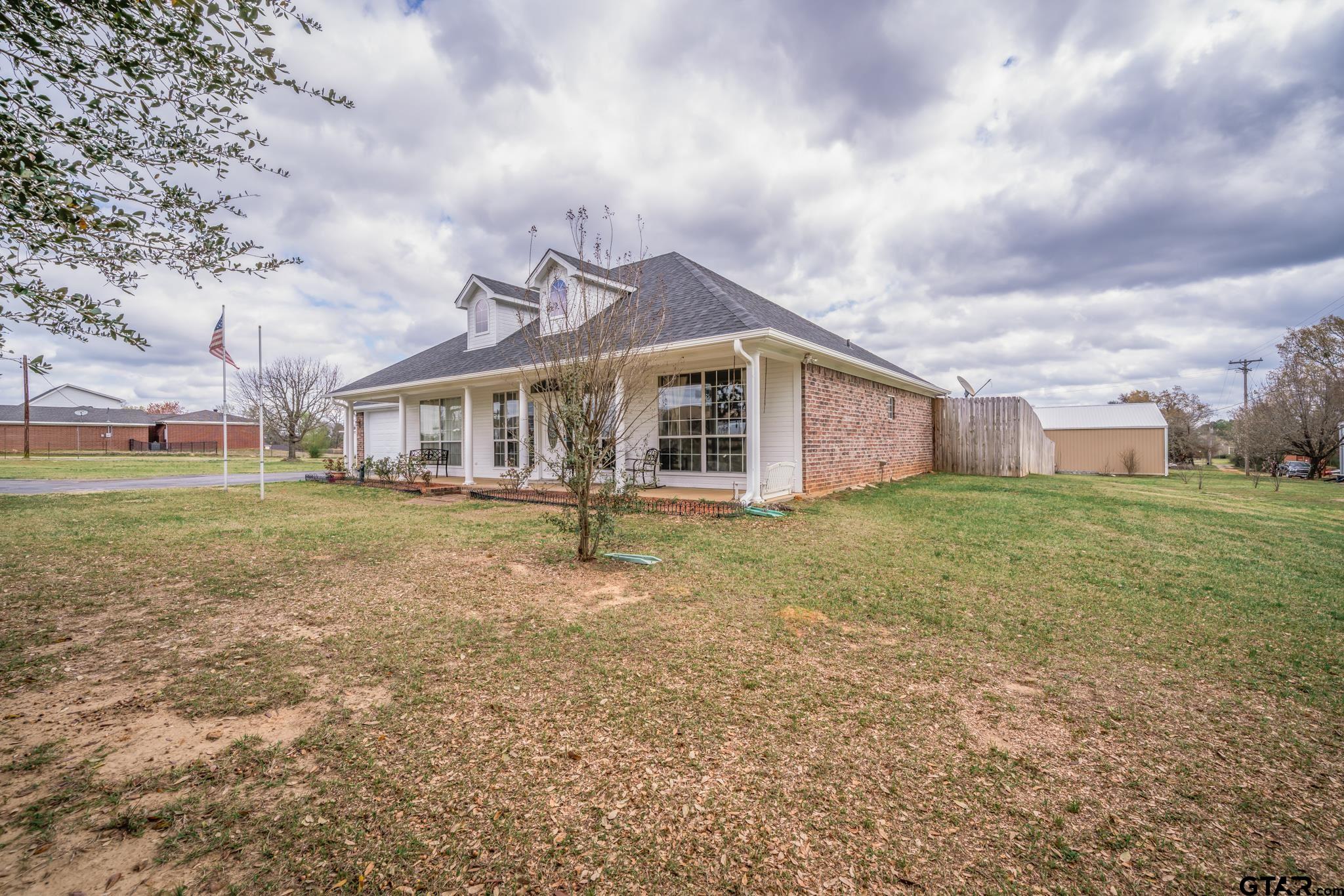 2266 Big Woods Road Longview, TX 75605 - Photo 5 of 48 a view of a house with a yard