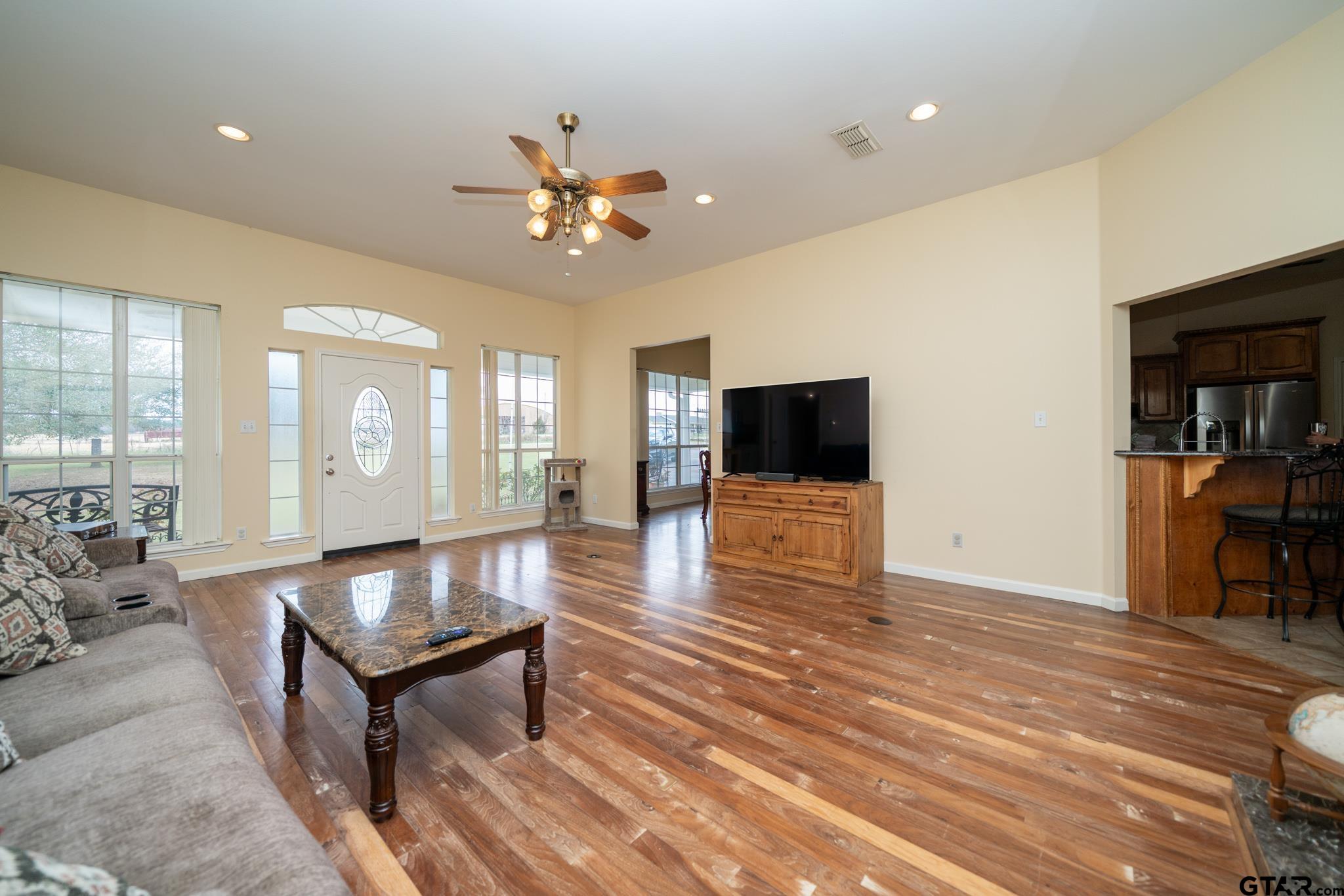 2266 Big Woods Road Longview, TX 75605 - Photo 6 of 48 a living room with furniture and a flat screen tv