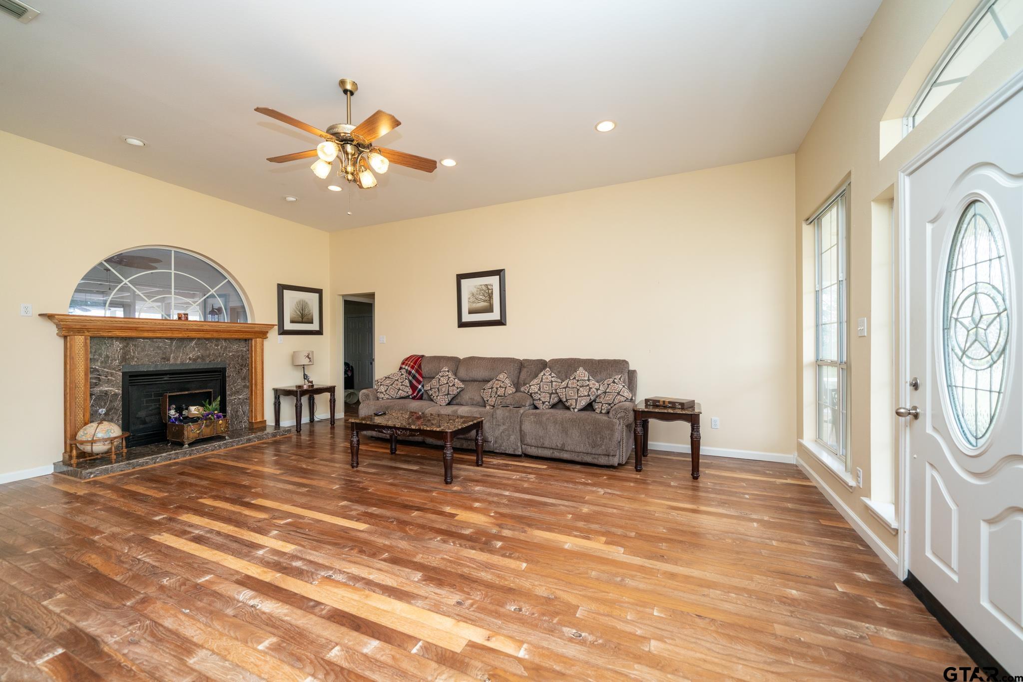 2266 Big Woods Road Longview, TX 75605 - Photo 9 of 48 a living room with furniture and a fireplace
