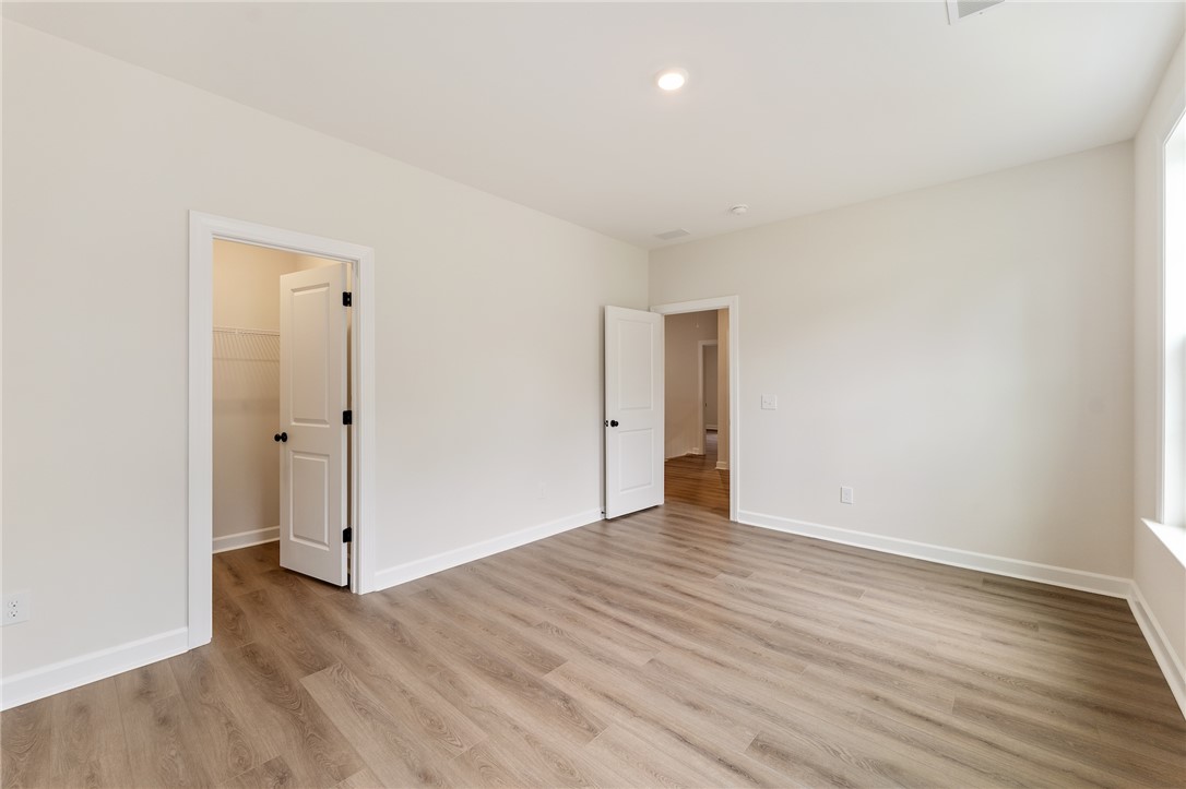 705 Weathered Oak Way Anderson, SC 29621 - Photo 38 of 47 This spacious room features bright lighting, durable flooring, and convenient closet access.