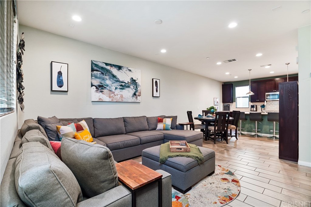 14865 West Maple Terrace Panorama City, CA 91402 - Photo 11 of 36 a living room with furniture and kitchen view