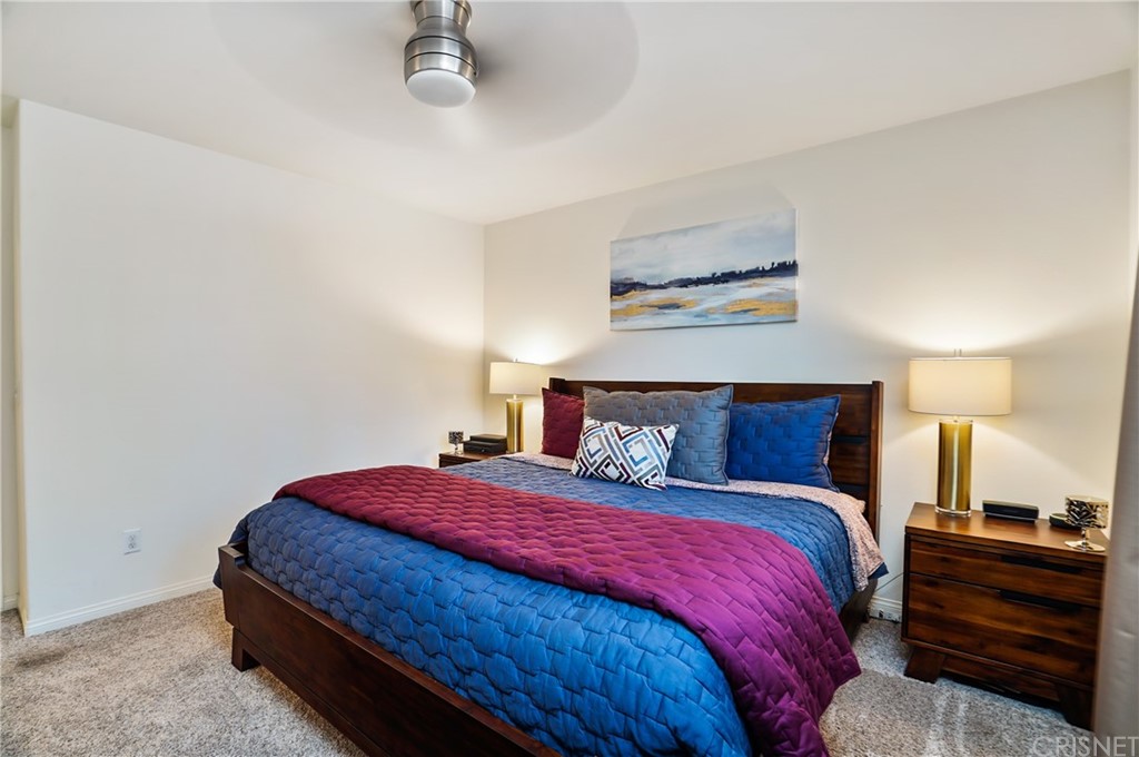 14865 West Maple Terrace Panorama City, CA 91402 - Photo 19 of 36 a bedroom with a bed and a night stand