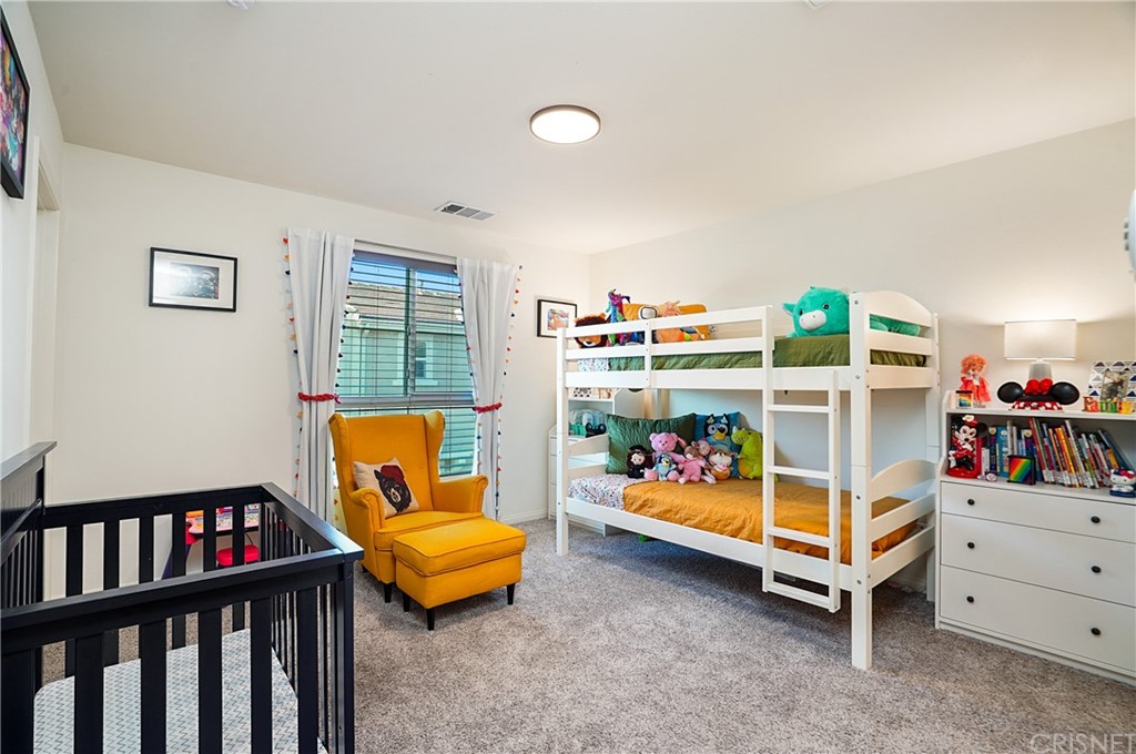 14865 West Maple Terrace Panorama City, CA 91402 - Photo 25 of 36 a bedroom with bunk beds and a baby crib