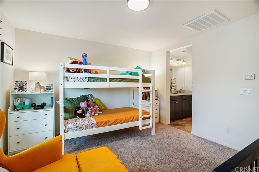 14865 West Maple Terrace Panorama City, CA 91402 - Photo 26 of 36 a bedroom with a bed and a dresser