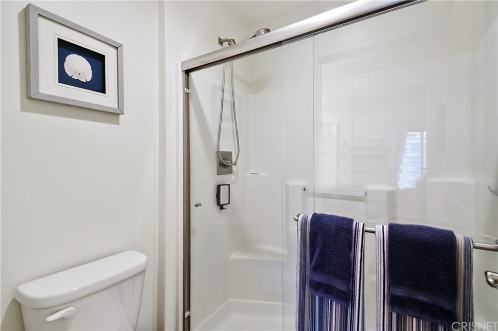 14865 West Maple Terrace Panorama City, CA 91402 - Photo 28 of 36 a bathroom with a toilet and a shower