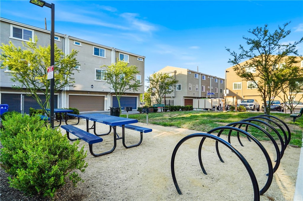 14865 West Maple Terrace Panorama City, CA 91402 - Photo 29 of 36 a swimming pool with outdoor seating and yard