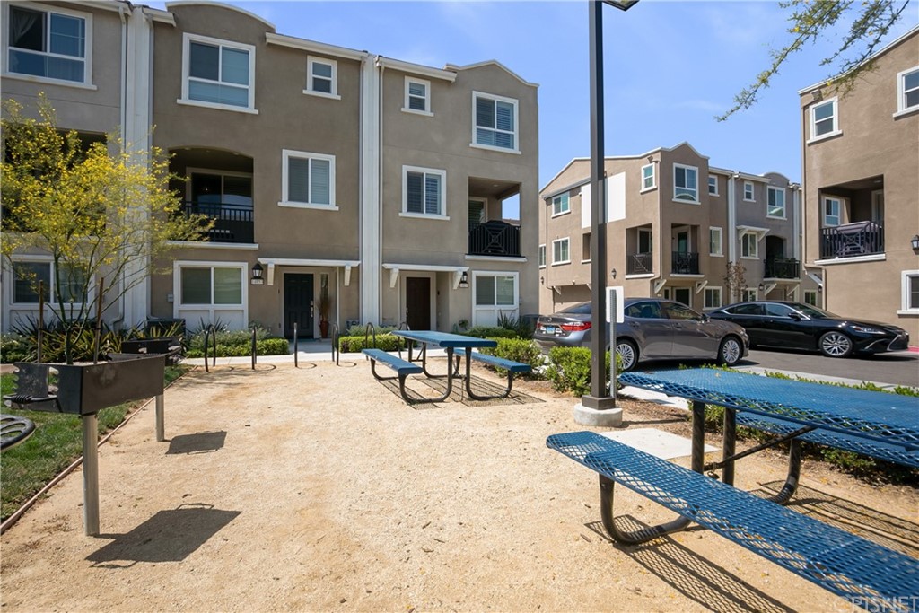 14865 West Maple Terrace Panorama City, CA 91402 - Photo 31 of 36 a view of a building with sitting area and furniture