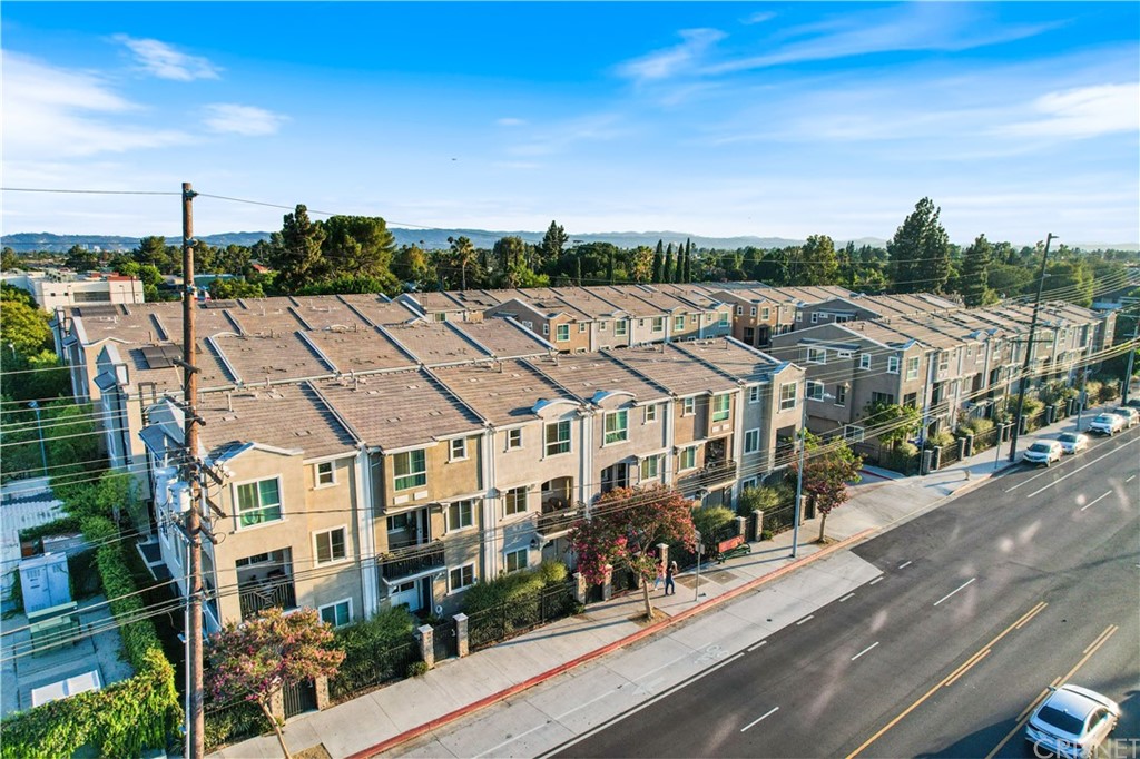 14865 West Maple Terrace Panorama City, CA 91402 - Photo 34 of 36 a aerial view of a large house with a yard and potted plants