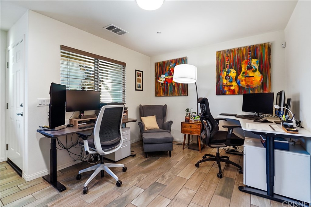 14865 West Maple Terrace Panorama City, CA 91402 - Photo 5 of 36 a view of a workspace with furniture and a window