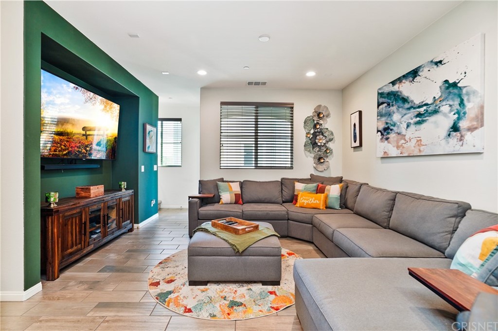 14865 West Maple Terrace Panorama City, CA 91402 - Photo 10 of 36 a living room with furniture and a flat screen tv