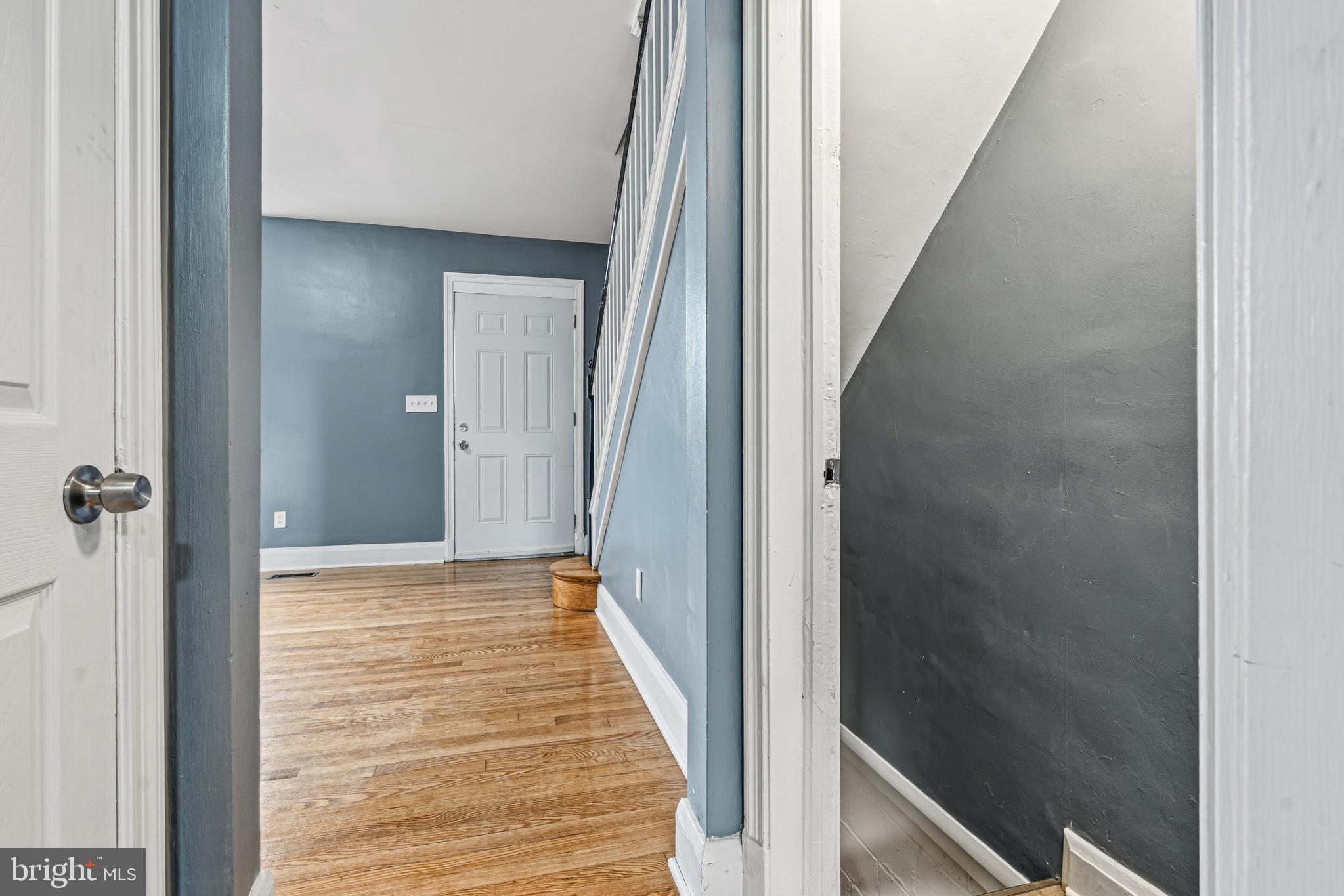 2410 Keyway Dundalk, MD 21222 - Photo 12 of 34 a view of a hallway with wooden floor and staircase