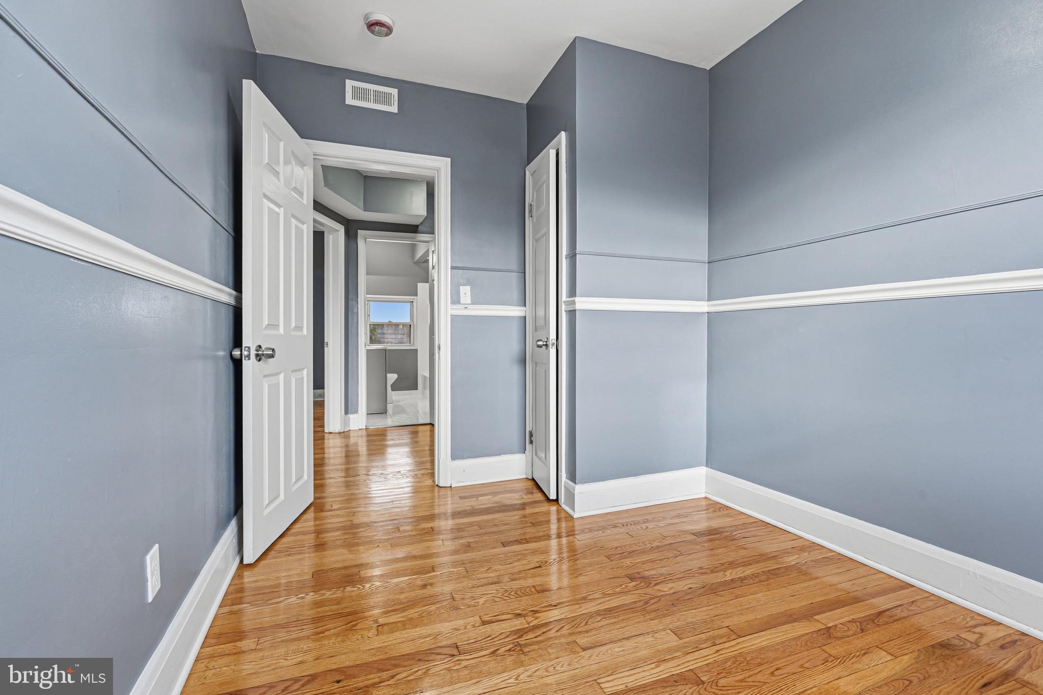 2410 Keyway Dundalk, MD 21222 - Photo 18 of 34 a view of a hallway with wooden floor