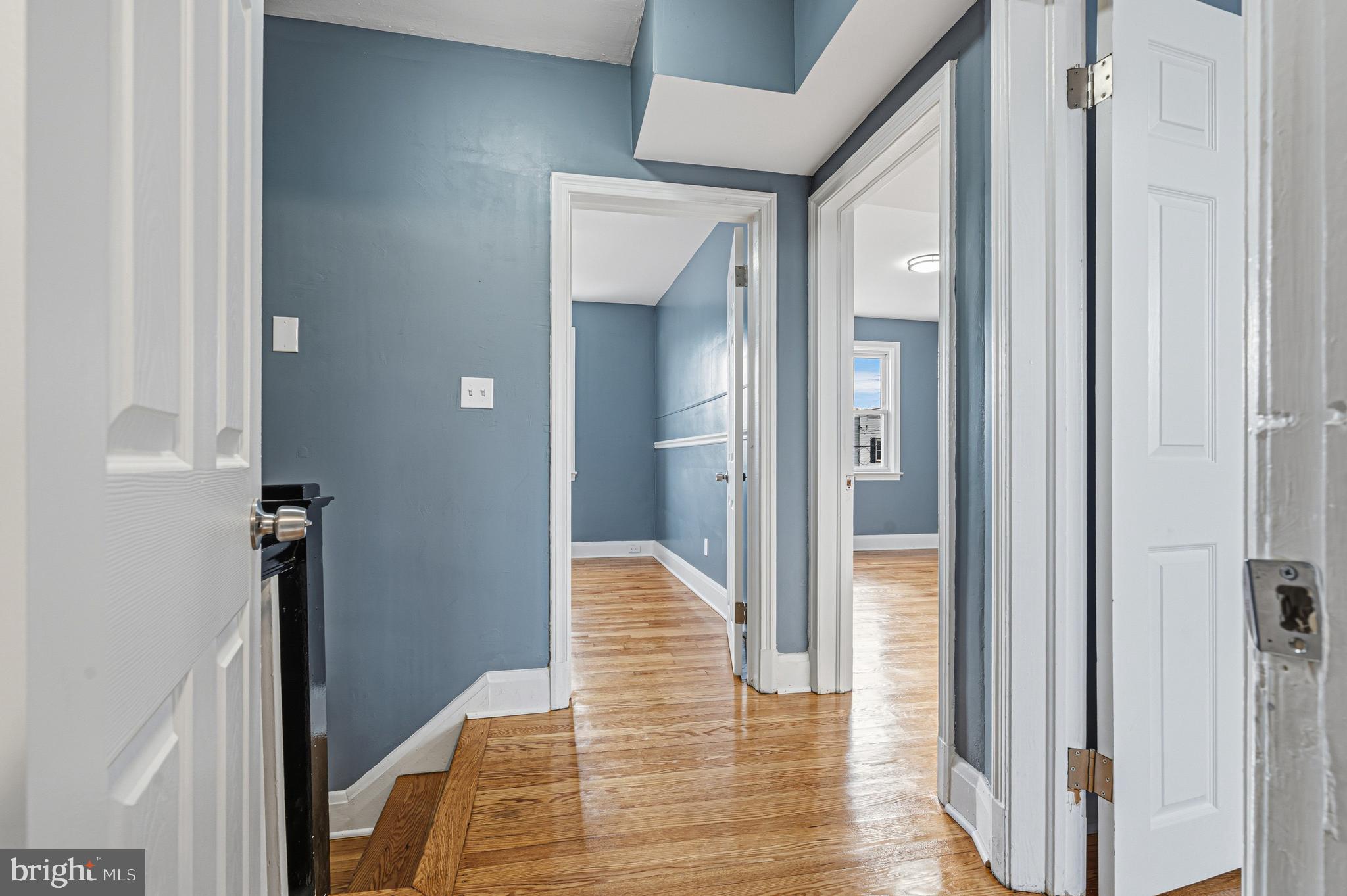 2410 Keyway Dundalk, MD 21222 - Photo 22 of 34 a view of a hallway with wooden floor and staircase