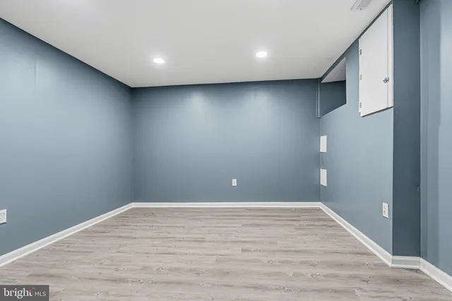 a view of front door of house and wooden floor