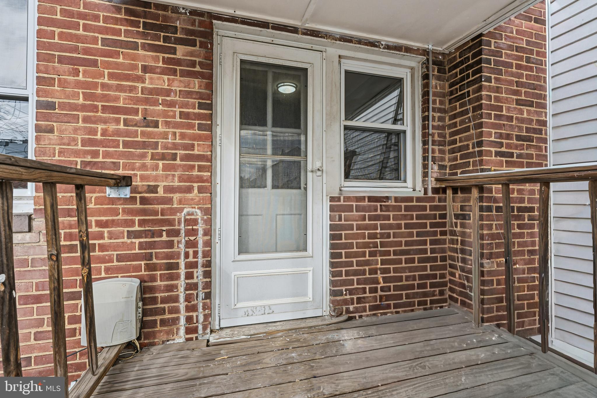 2410 Keyway Dundalk, MD 21222 - Photo 30 of 34 a view of front door of house and wooden floor