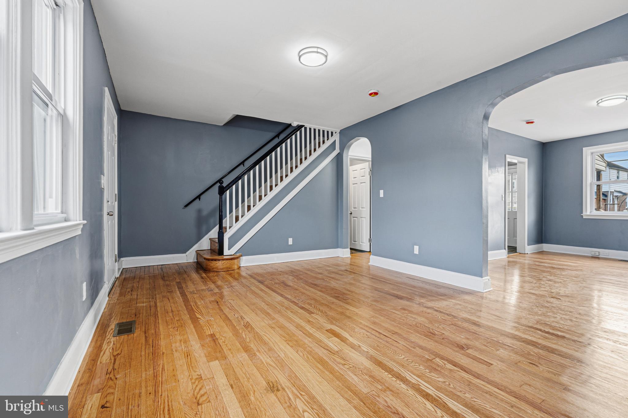 2410 Keyway Dundalk, MD 21222 - Photo 5 of 34 a view of an empty room with wooden floor and stairs