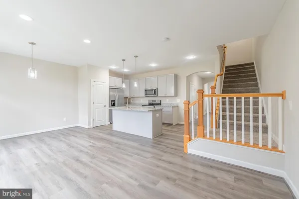 a view of kitchen with wooden floor