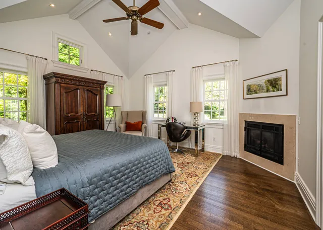 a bed room with a bed and a fireplace