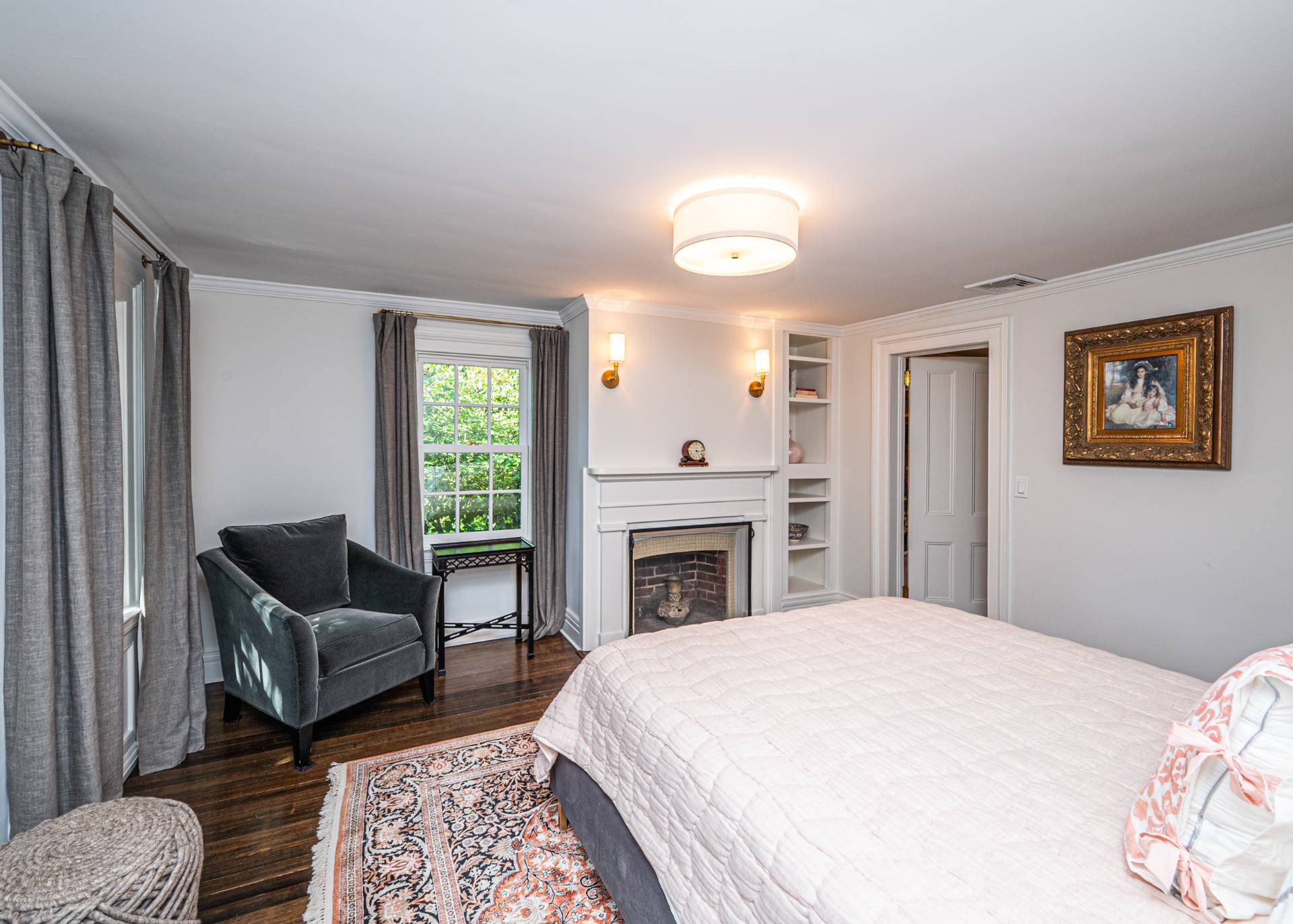 92 South Country Road Remsenburg-Speonk, NY 11960 - Photo 18 of 30 a spacious bedroom with a bed and a couch