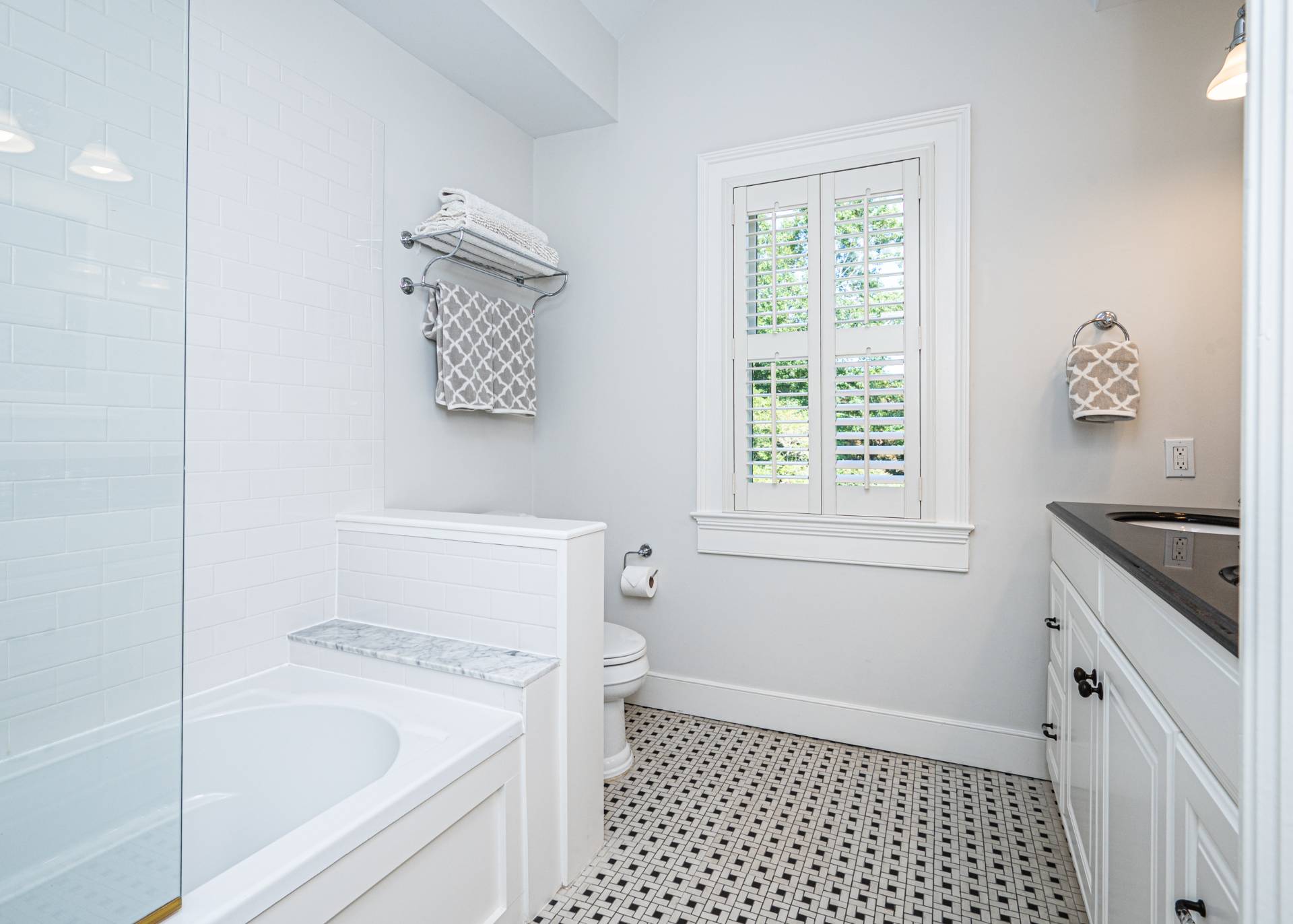 92 South Country Road Remsenburg-Speonk, NY 11960 - Photo 21 of 30 a bathroom with a granite countertop sink a toilet a window and a shower