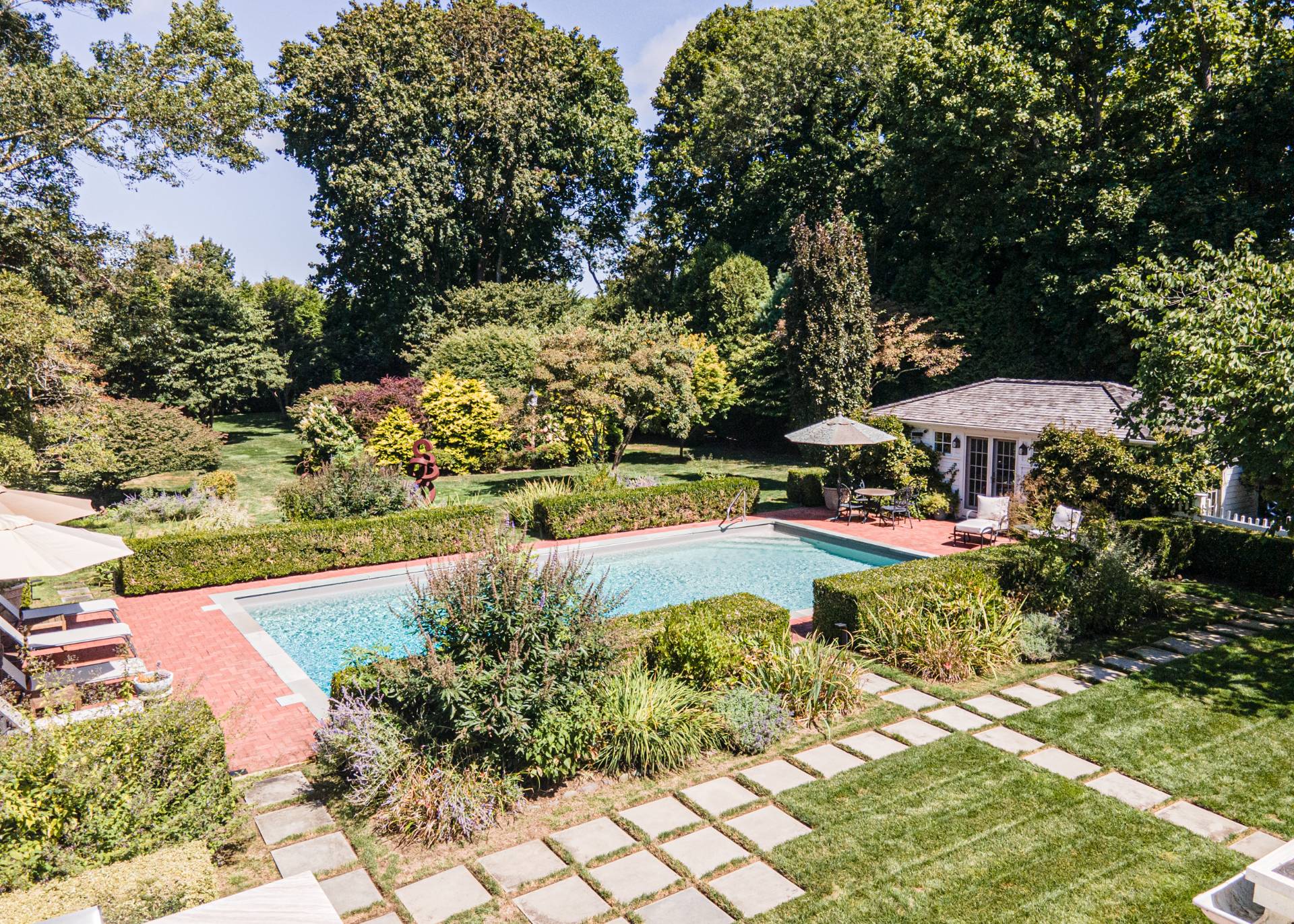 92 South Country Road Remsenburg-Speonk, NY 11960 - Photo 24 of 30 a view of swimming pool with lawn chairs and plants