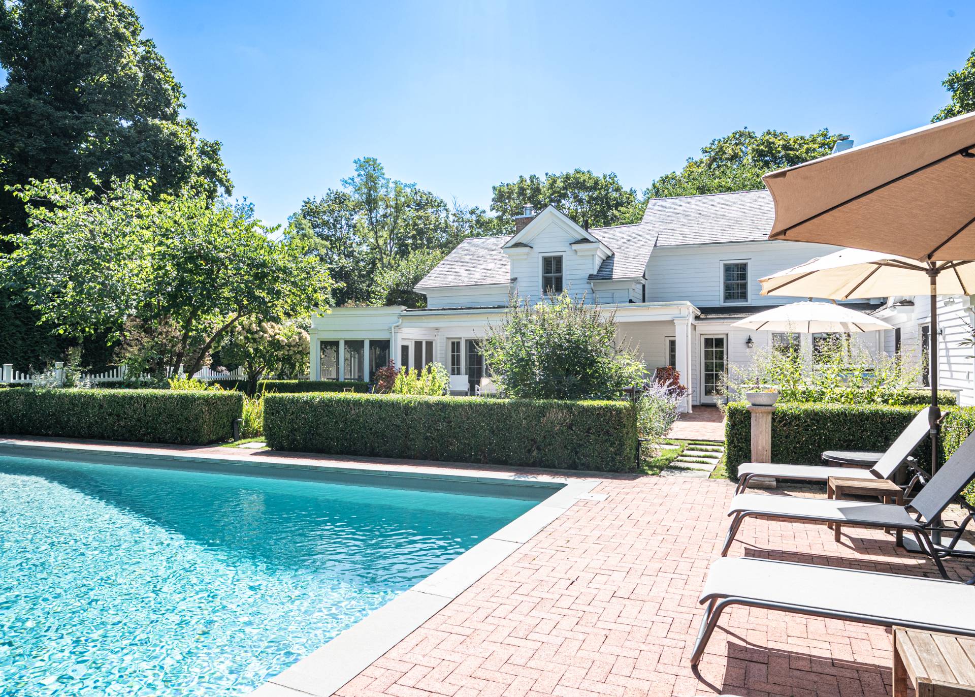 92 South Country Road Remsenburg-Speonk, NY 11960 - Photo 27 of 30 a view of house with swimming pool and outdoor seating