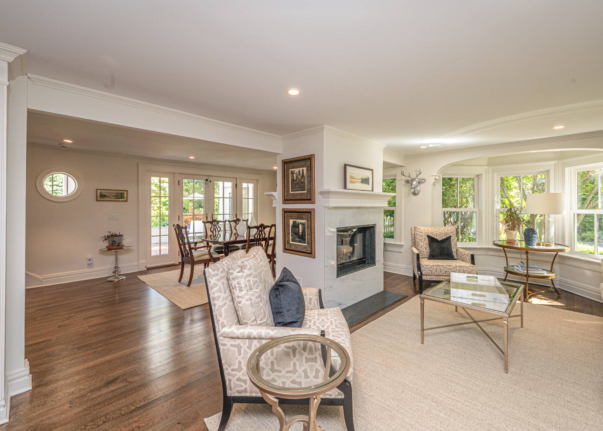 92 South Country Road Remsenburg-Speonk, NY 11960 - Photo 4 of 30 a living room with furniture a fireplace and a table
