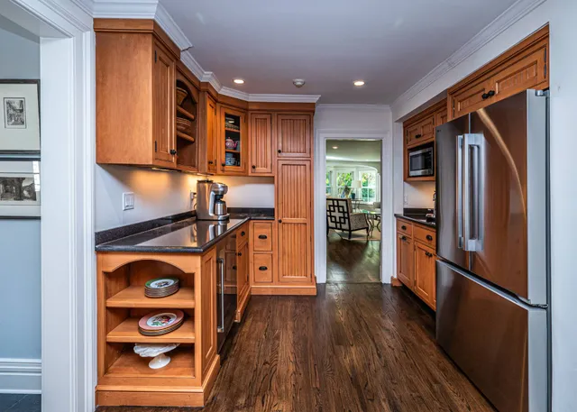 a view of kitchen with furniture and wooden floor