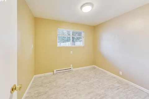 a view of a small space with a wooden floor