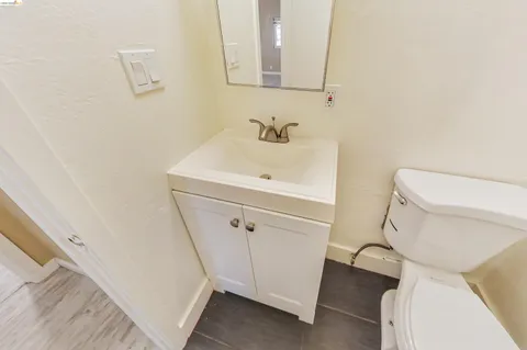 a bathroom with a sink toilet and vanity