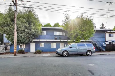 a front view of a house with parking space