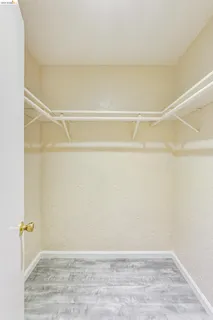 a white bath tub sitting next to a white toilet