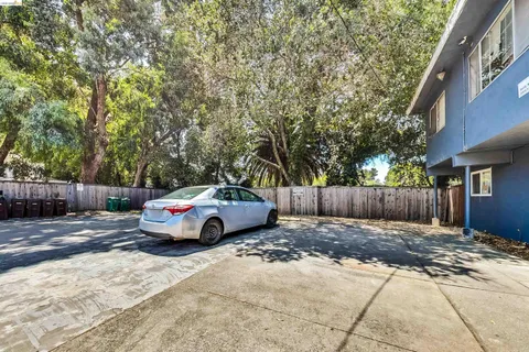 a view of a wooden door with a backyard